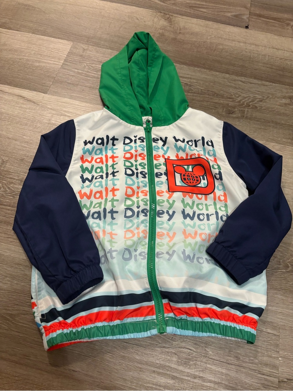 Disney Green Hooded Windbreaker with Navy Sleeves and Multicolor Print
